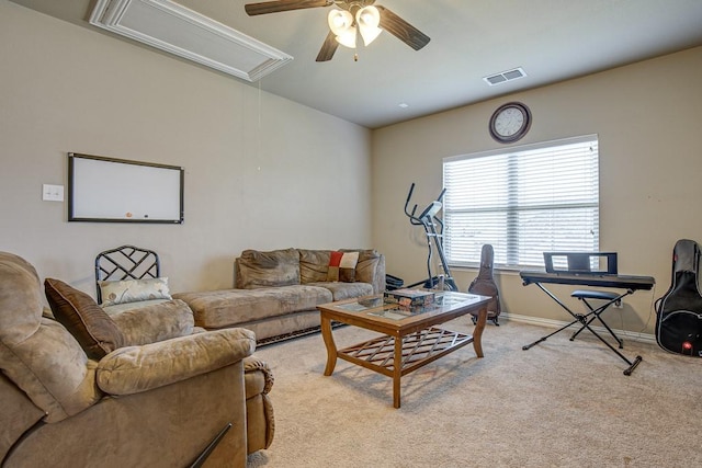 carpeted living room featuring ceiling fan