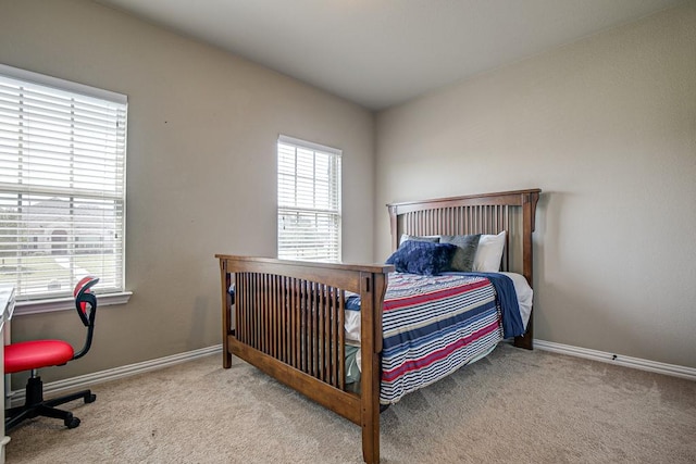 bedroom with light carpet