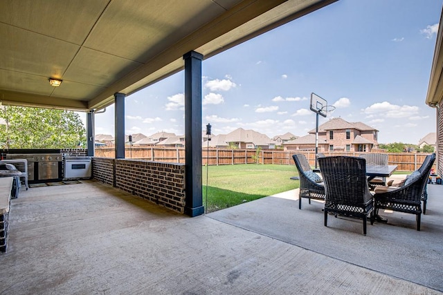 view of patio / terrace featuring exterior kitchen