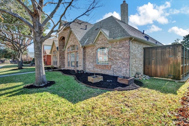 view of home's exterior with a lawn