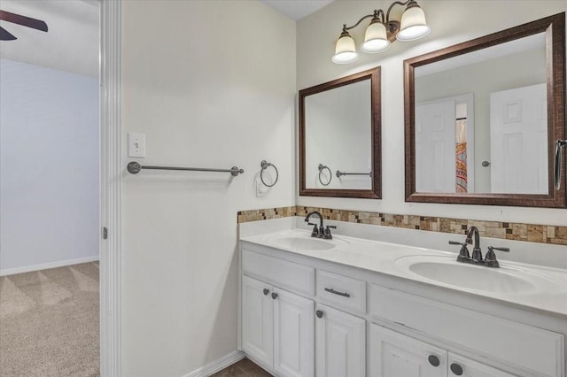 bathroom with ceiling fan and vanity