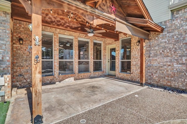 view of patio featuring ceiling fan