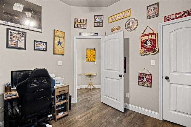 home office featuring dark wood finished floors and baseboards