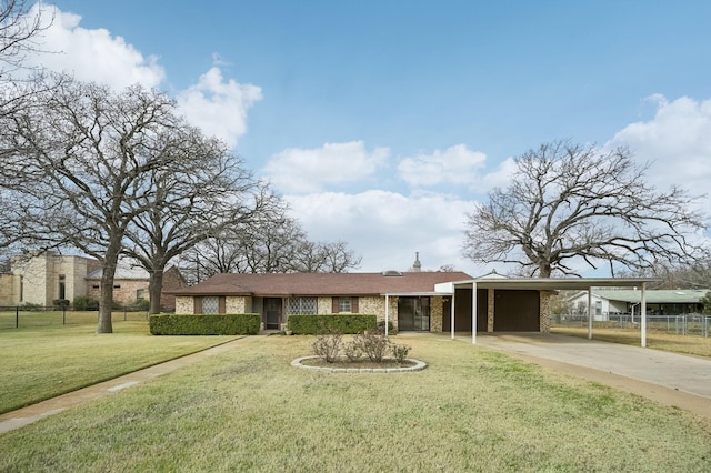 single story home featuring a carport and a front yard