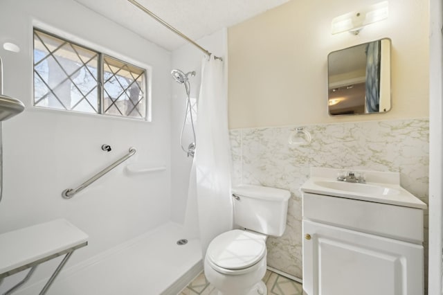 bathroom featuring toilet, tile walls, a shower with curtain, and vanity