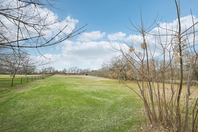 view of yard with a rural view