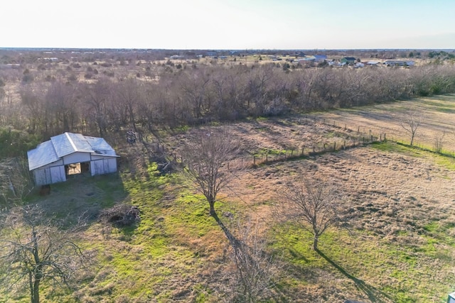 birds eye view of property featuring a rural view