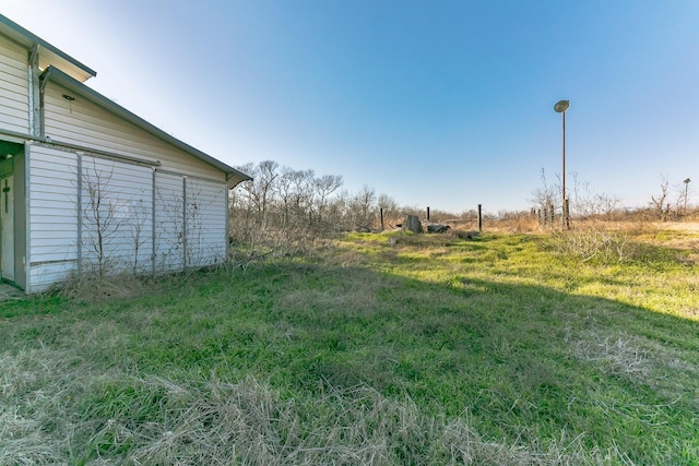 view of yard with a rural view