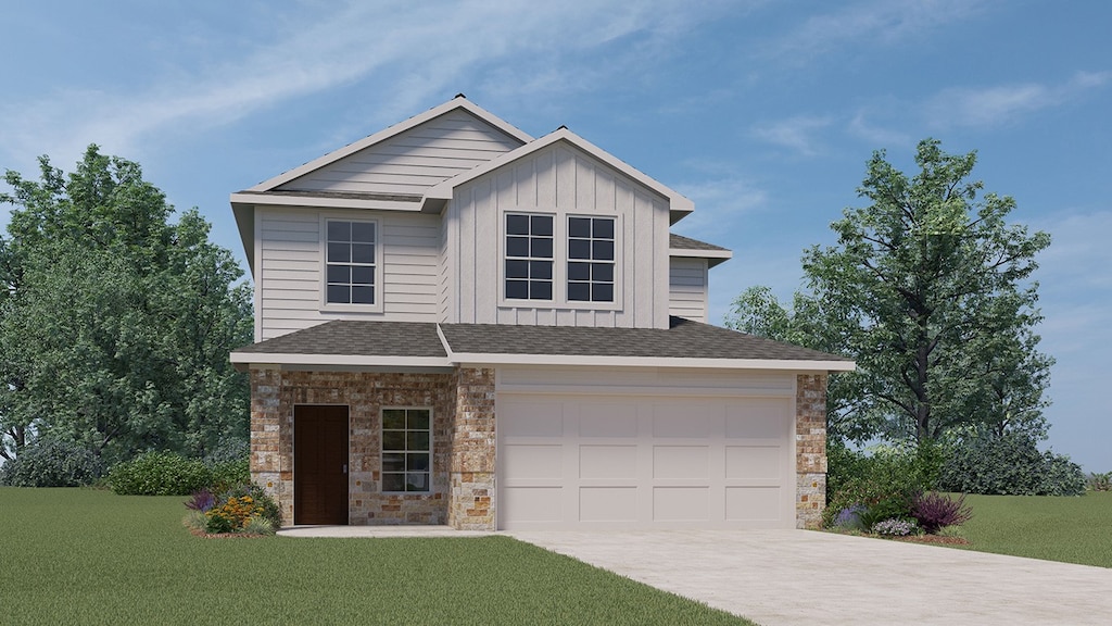 view of front facade featuring a garage and a front lawn