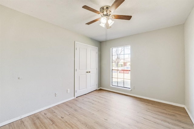 unfurnished room featuring ceiling fan and light hardwood / wood-style flooring