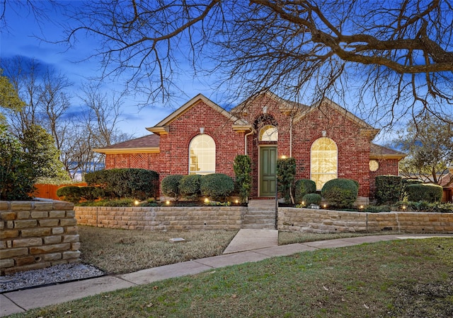 front facade with a lawn