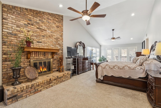 carpeted bedroom featuring ceiling fan, a fireplace, and high vaulted ceiling