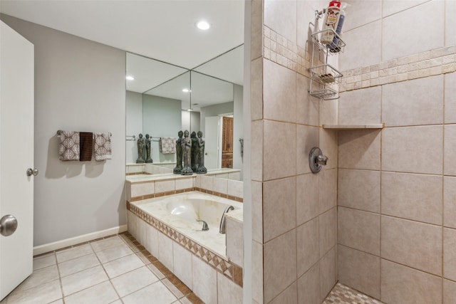 bathroom featuring tile patterned flooring and independent shower and bath