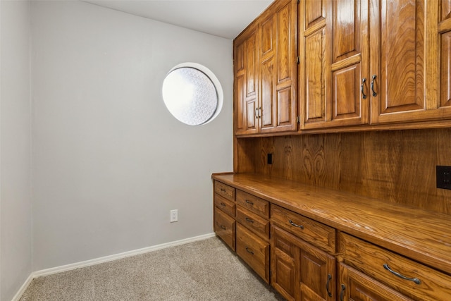 interior space featuring light carpet