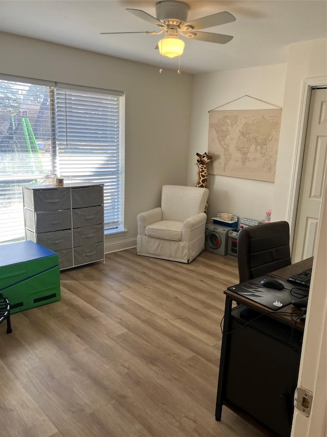 office area with hardwood / wood-style floors and ceiling fan