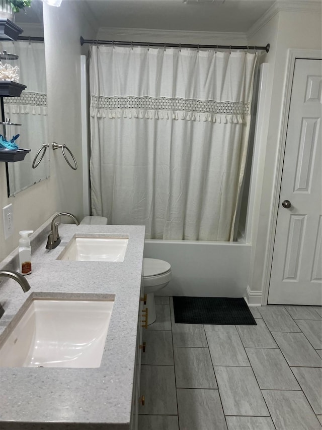 full bathroom with ornamental molding, vanity, toilet, and shower / bath combo with shower curtain