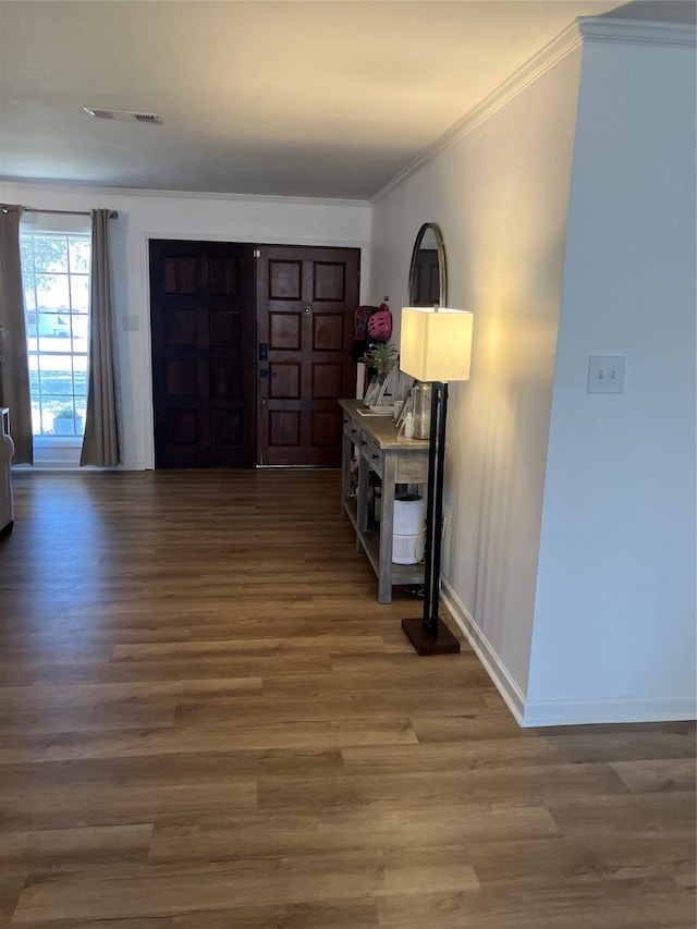 entryway featuring crown molding and wood-type flooring