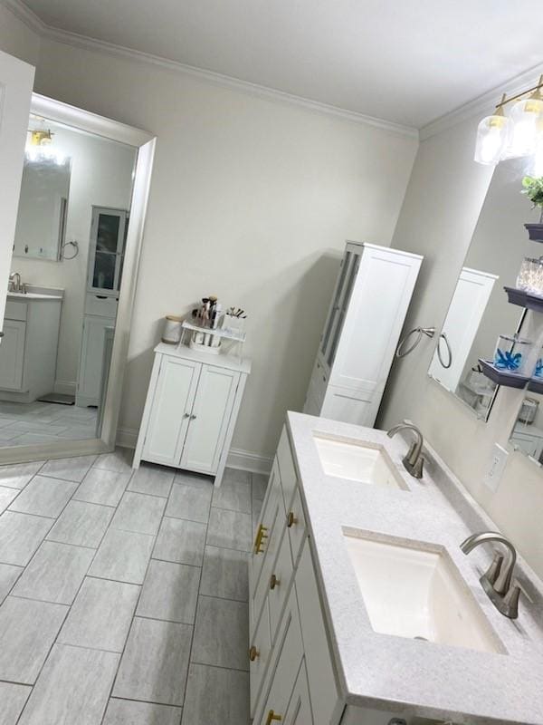 bathroom featuring crown molding and vanity