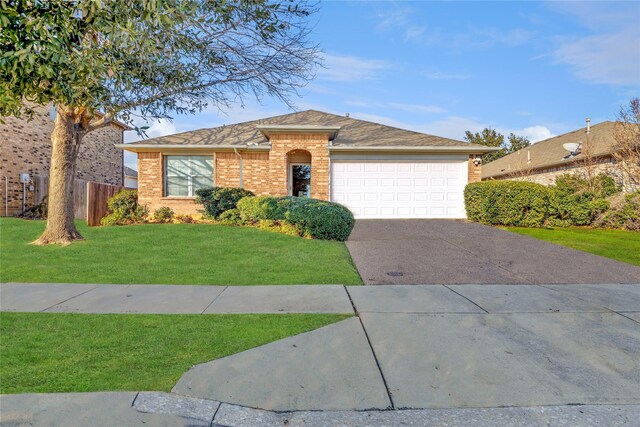 ranch-style home featuring a front yard and a garage