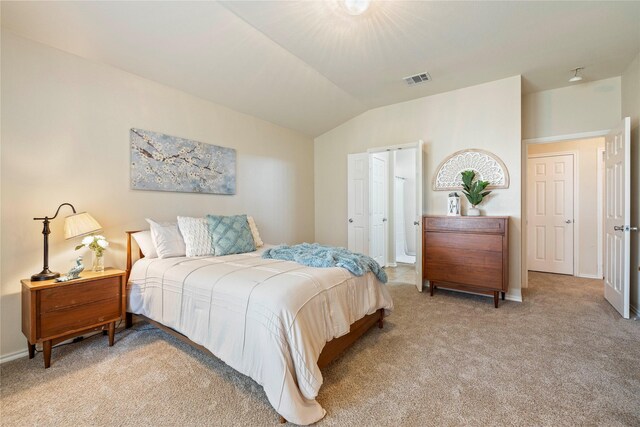 bedroom featuring baseboards, visible vents, and light colored carpet