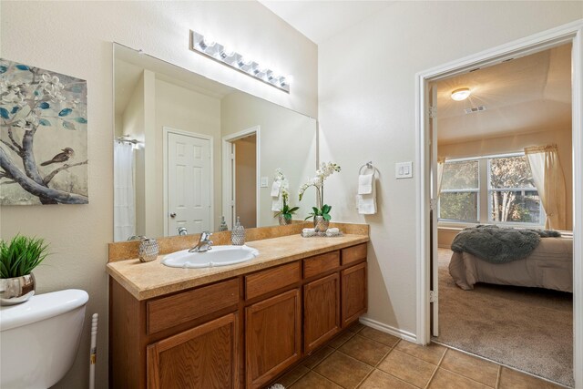 hall featuring light carpet, a textured wall, and baseboards