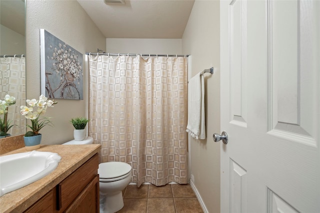 full bath with toilet, tile patterned flooring, and vanity