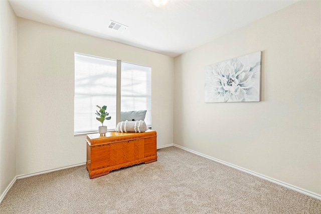 office with carpet floors, visible vents, and baseboards