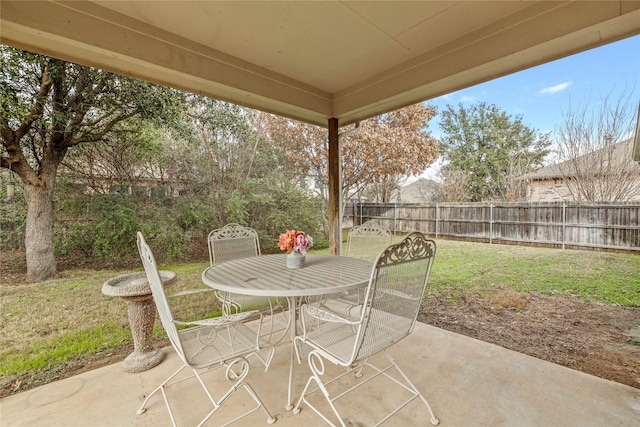 view of patio with outdoor dining area and a fenced backyard