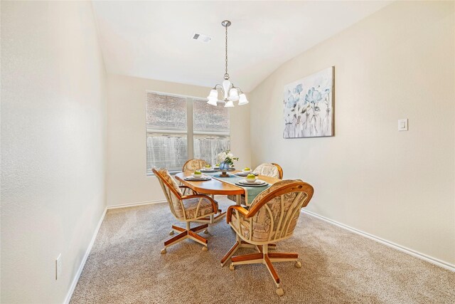 kitchen featuring decorative light fixtures, light countertops, visible vents, a kitchen island, and white appliances