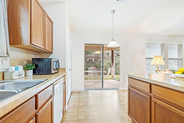 carpeted living area with lofted ceiling, ceiling fan, visible vents, and baseboards