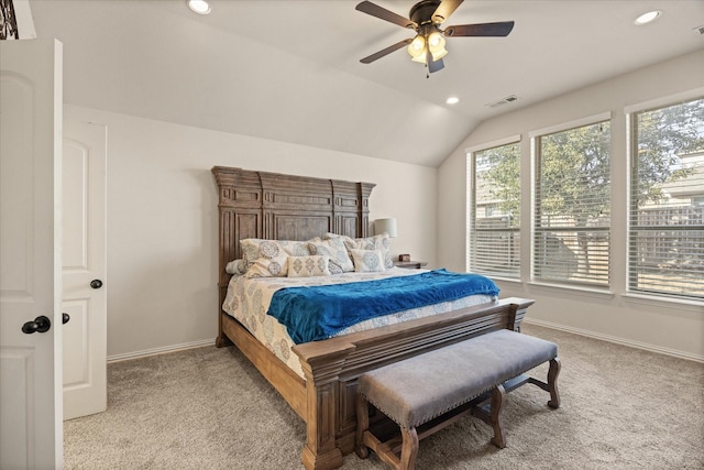 bedroom featuring ceiling fan, light carpet, and vaulted ceiling