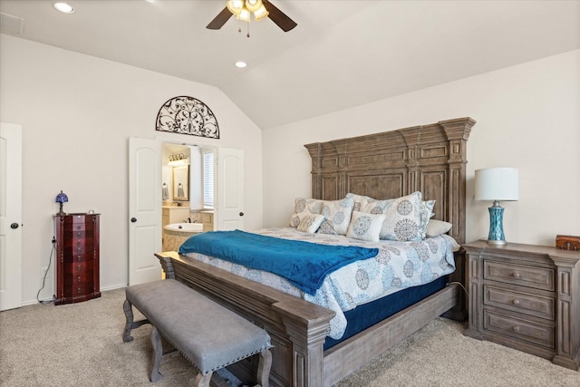 carpeted bedroom with vaulted ceiling, ceiling fan, and connected bathroom