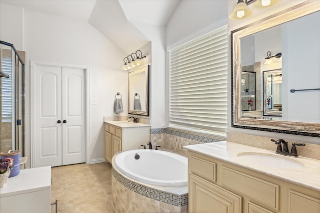 bathroom featuring lofted ceiling, tile patterned floors, vanity, a healthy amount of sunlight, and shower with separate bathtub