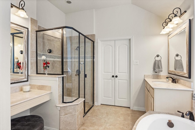 bathroom featuring vanity, vaulted ceiling, tile patterned floors, and a shower with door