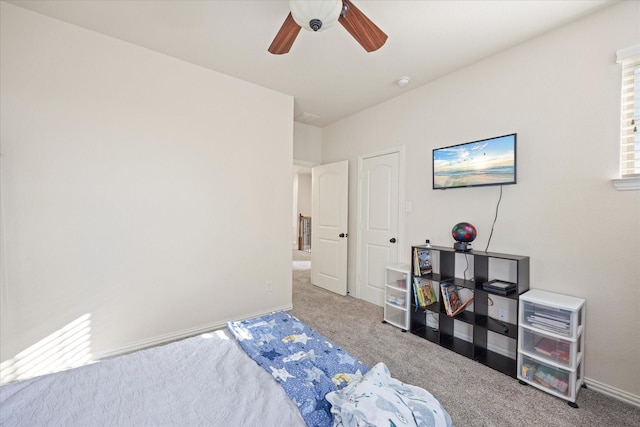 bedroom with ceiling fan and carpet flooring