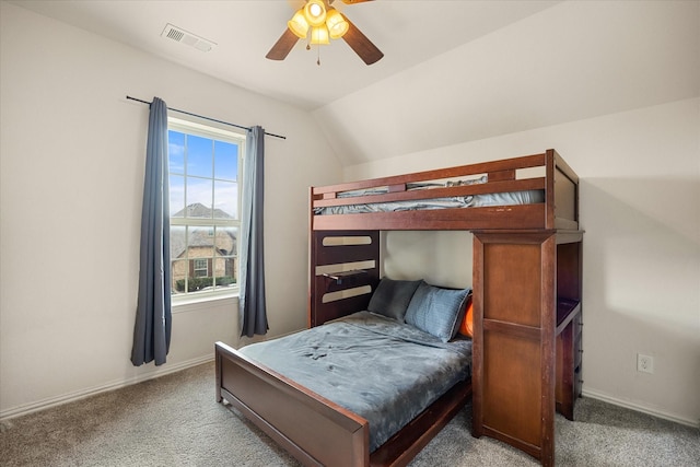 carpeted bedroom featuring ceiling fan and lofted ceiling