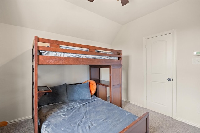 carpeted bedroom with ceiling fan and lofted ceiling