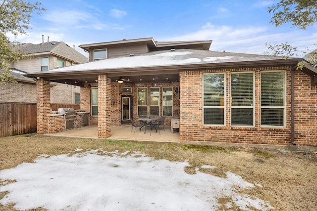 back of property with a patio and area for grilling