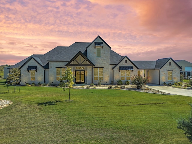 view of front of home with a lawn