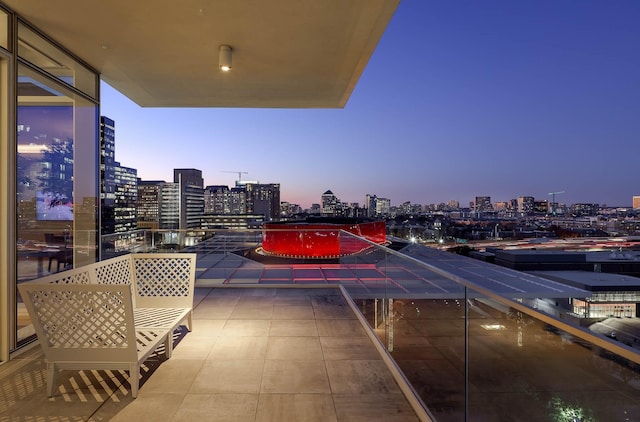 view of balcony at dusk