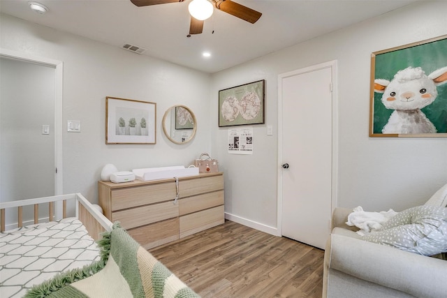 bedroom featuring ceiling fan and hardwood / wood-style floors