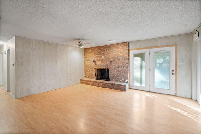 kitchen featuring light hardwood / wood-style floors, white electric range, decorative backsplash, sink, and a textured ceiling