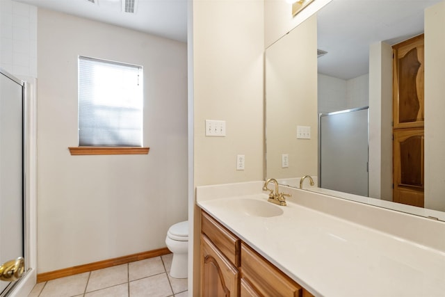 bathroom with toilet, a shower with door, tile patterned floors, and vanity