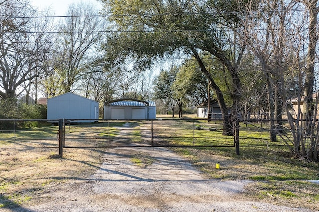 exterior space with a garage and an outdoor structure