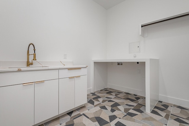 laundry area featuring washer hookup, cabinets, electric dryer hookup, and sink