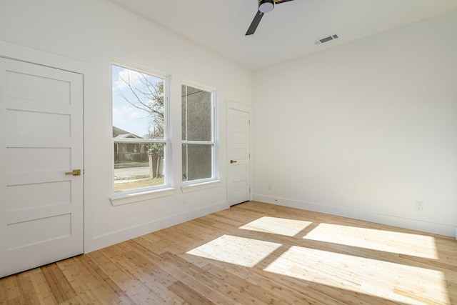 spare room with ceiling fan and light hardwood / wood-style floors