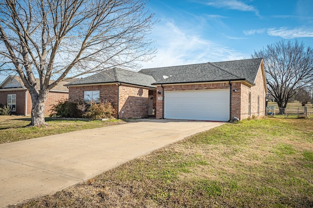 view of front of home with a garage and a front yard