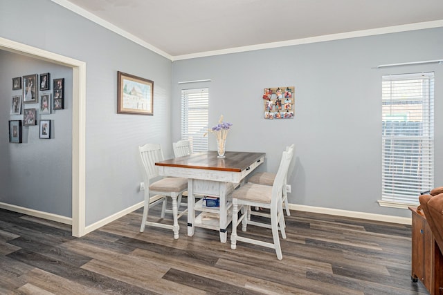 dining area featuring ornamental molding, dark hardwood / wood-style flooring, and a wealth of natural light