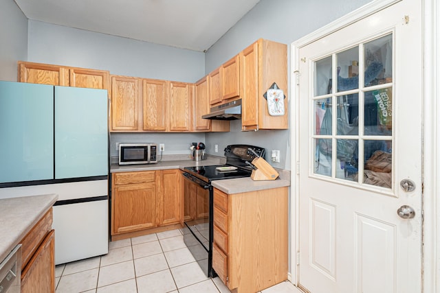 kitchen with light tile patterned floors and appliances with stainless steel finishes