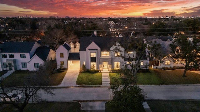 view of front of home with a yard